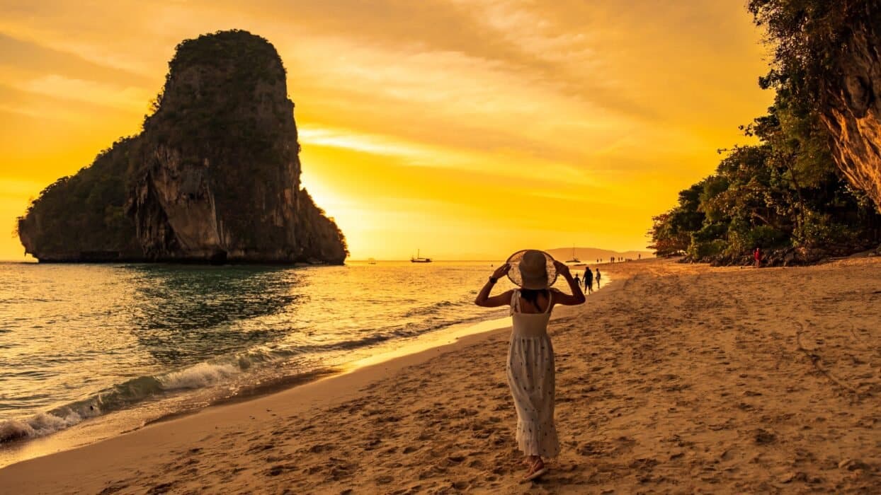 Phra Nang beach at sunset, a limestone island offshore